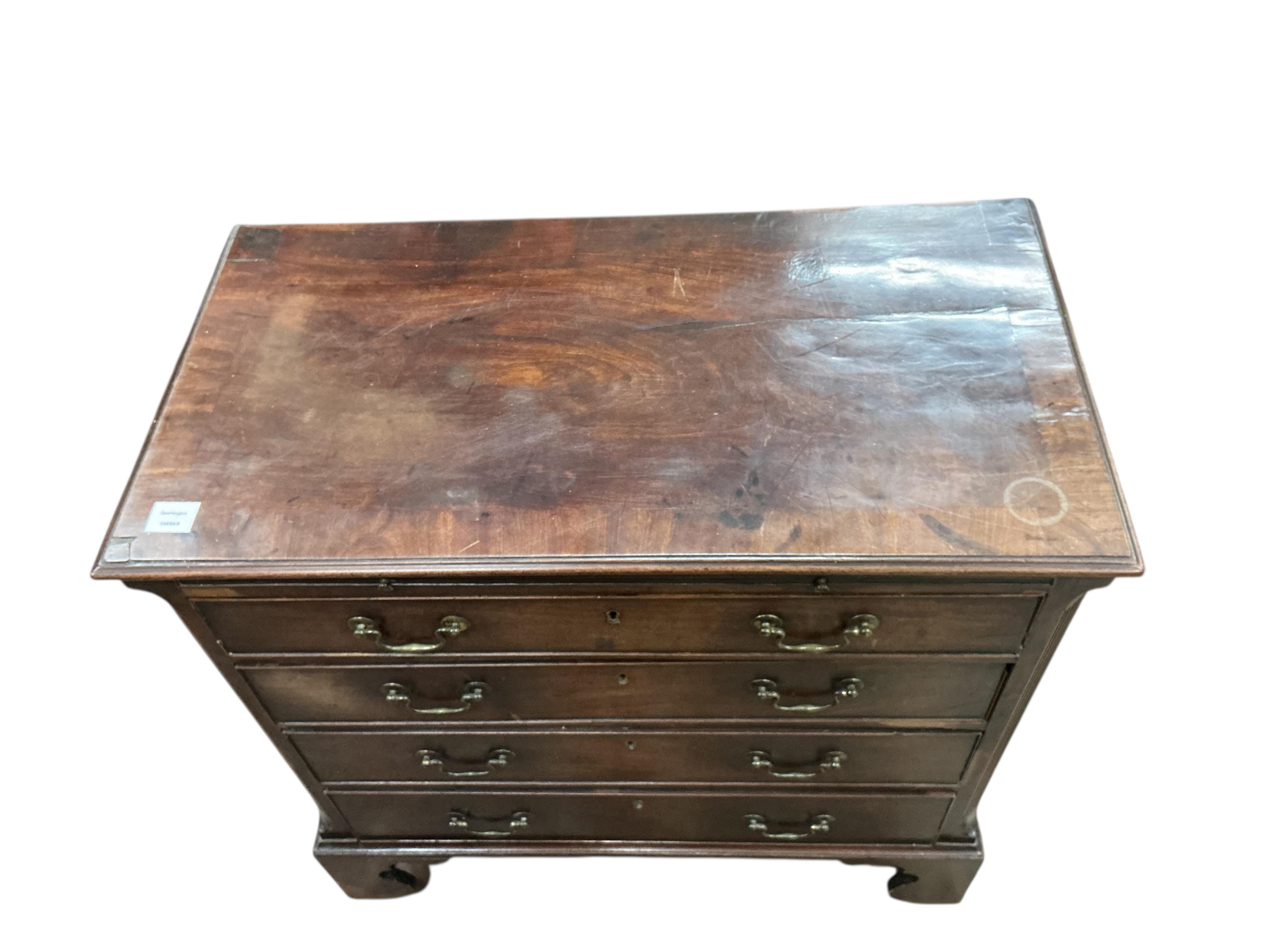 A George III mahogany chest of four drawers with brushing slide, width 87cm, depth 46cm, height 86cm